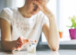 a woman examines a pill bottle and considers the side effects of benzos